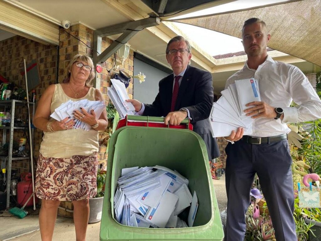 Annette Weller, Kevin Weller, Senator Paul Scarr with the dumped mailers.