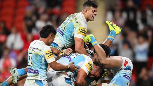 BRISBANE, AUSTRALIA - JULY 28: Klese Haas of the Titans celebrates scoring a try with team mates during the round 21 NRL match between Dolphins and Gold Coast Titans at Suncorp Stadium, on July 28, 2024, in Brisbane, Australia. (Photo by Matt Roberts/Getty Images)