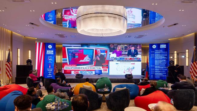 People watch television coverage of the US election at an event organised by the US embassy in Ulaanbaatar, the capital of Mongolia. Picture: AFP