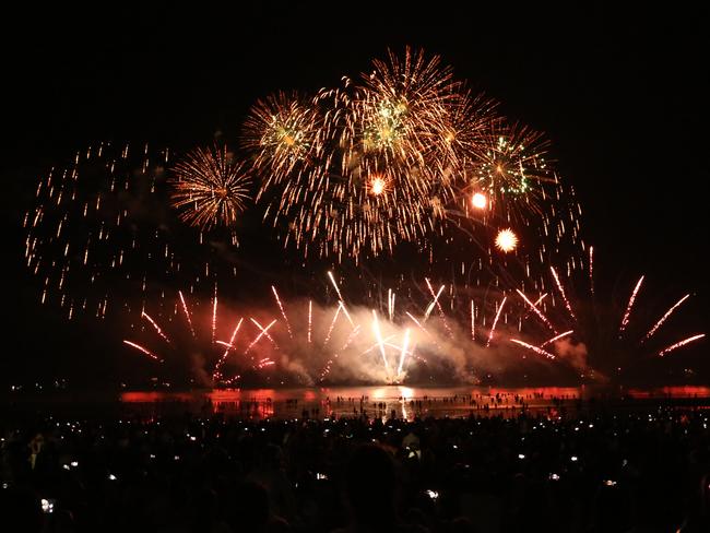 Territorians gather along the shores of Darwin Harbour to celebrate Territory Day on Monday nightt. Picture: Glenn Campbell