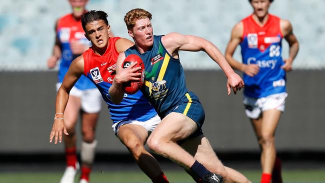 Matthew Rowell bursts away from congestion during the AFL Academy’s victory over Casey Demons at the MCG. Picture: Michael Willson/AFL Photos/Getty Images)