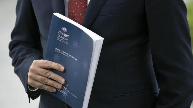 Australian Treasurer Jim Chalmers arrives at Parliament House in Canberra, documents in hand, to deliver the 2022 federal budget. Picture: NCA NewsWire / Gary Ramage