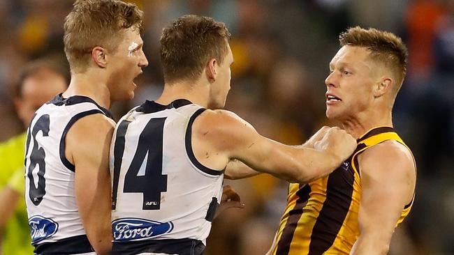 Scott Selwood and Joel Selwood remonstrate with Sam Mitchell. (Photo by Adam Trafford/AFL Media/Getty Images)