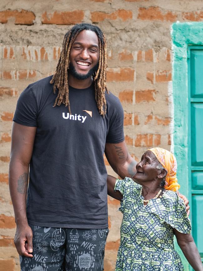 The local women found his towering frame amusing. (Picture: Nick Ralph)