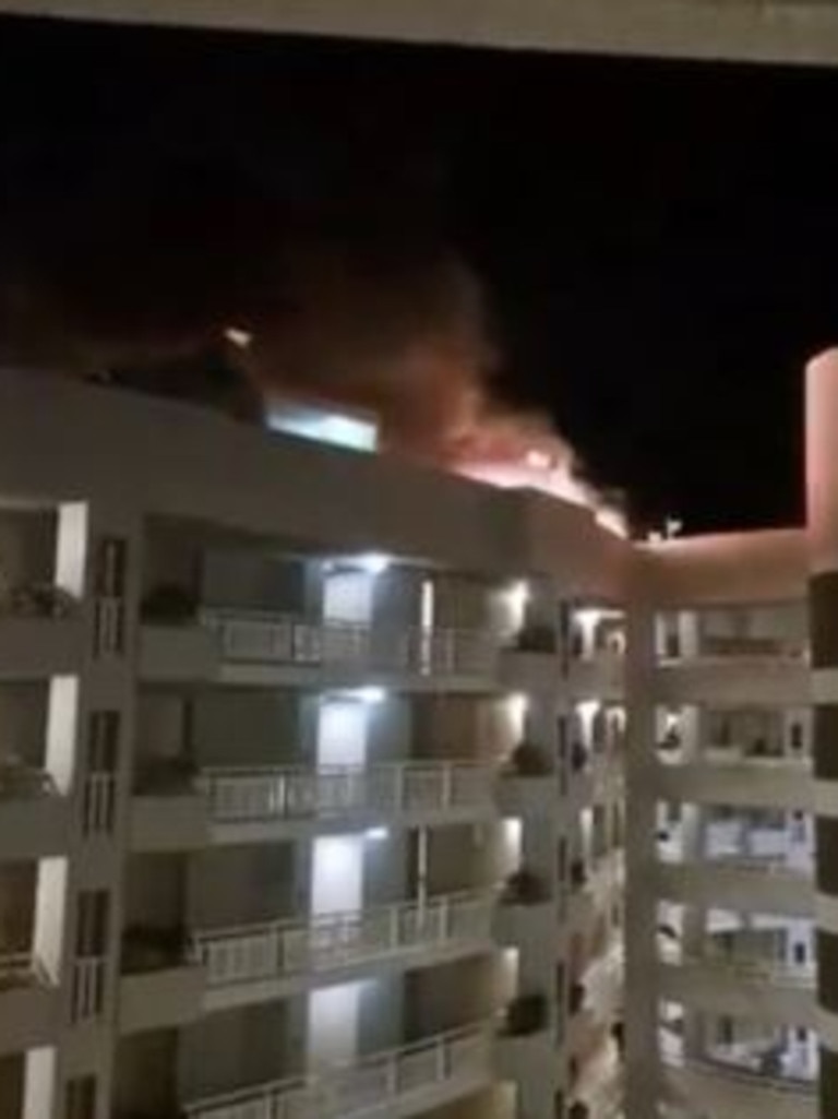 Up to 400 people were evacuated from the DoubleTree Hotel by Hilton about 1.50am on Monday after a twin engine helicopter crashed into the roof. Picture: 9 News