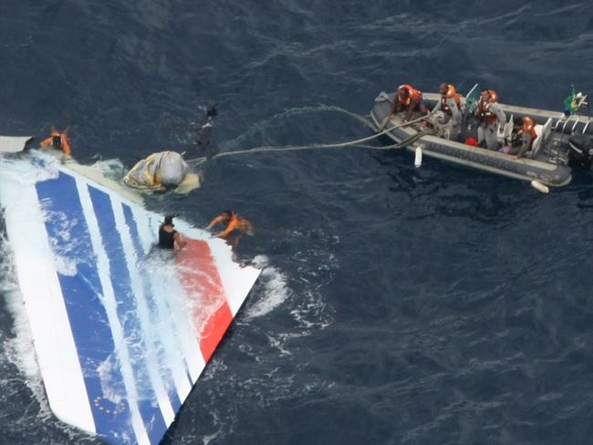 Brazil's Navy sailors recover debris from the missing Air France Flight 447 in the Atlantic Ocean. Picture: AP/Brazil's Air Force