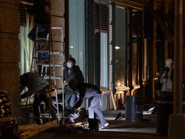 Workers board up a shop in New York City amid fears of violence after the US election. Picture: AFP