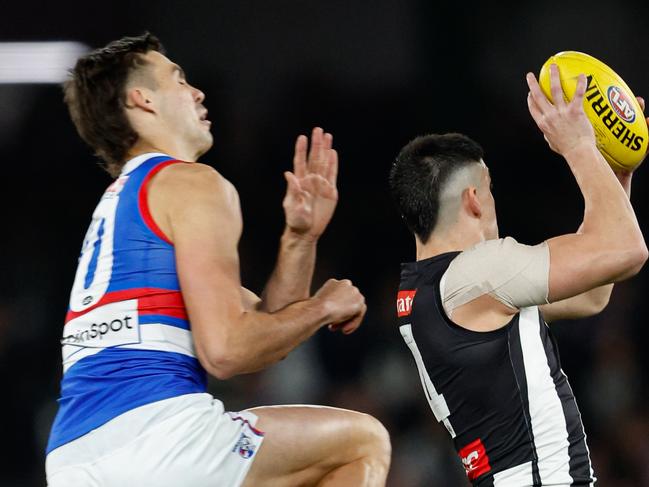 MELBOURNE, AUSTRALIA - MAY 31: Brayden Maynard of the Magpies receives a receives a heavy bump from Sam Darcy of the Bulldogs during the 2024 AFL Round 12 match between the Collingwood Magpies and the Adelaide Crows at The Melbourne Cricket Ground on May 31, 2024 in Melbourne, Australia. (Photo by Dylan Burns/AFL Photos via Getty Images)