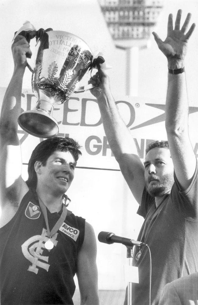 Victory ... Carlton captain Stephen Kernahan and coach Robert Walls with premiership cup. The Blues won 15.14 (104) to 9.17 (71). ‘Sticks’ and Craig Bradley booted three, with David Rhys-Jones earning the Norm Smith medal.