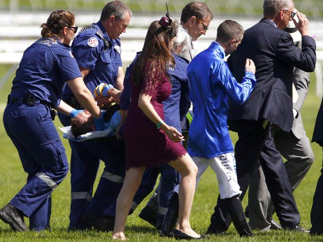 Jockey Hugh Bowman is carried off the Randwick track on Guineas Day. Picture: AAP