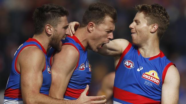 BALLARAT, AUSTRALIA - APRIL 10: Jack Macrae of the Bulldogs (C) celebrates a goal during the round four AFL match between the Western Bulldogs and the Brisbane Lions at Mars Stadium on April 10, 2021 in Ballarat, Australia. (Photo by Daniel Pockett/Getty Images)