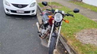 The Jones's 1999 Honda CB250 motorcycle, where it was parked when they received a parking ticket. Picture: Supplied