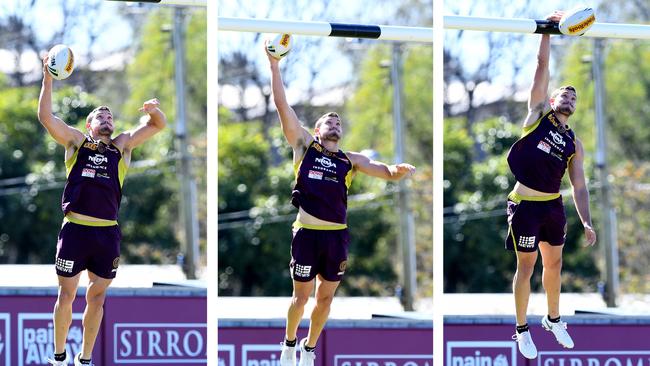 Corey Oates slam-dunking the ball over the post during the Brisbane Broncos training session in Brisbane, Monday, July 30. Picture: AAP Image