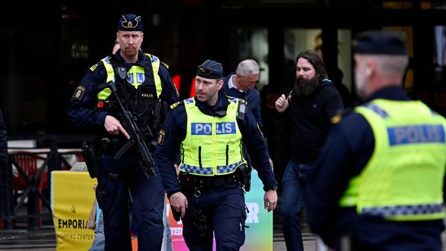 Swedish armed police officers patrol outside the Eurovision venue. Picture: Johan Nilsson /AFP