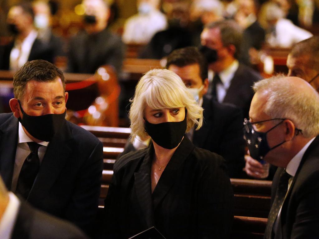 Prime Minister Scott Morrison and Victorian Premier Daniel Andrews have put aside their political differences to honour the TV great, taking a seat next to each other inside the church. Picture: Darrian Traynor/Getty Images