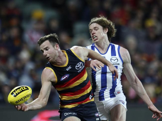 19/08/18 - AFL - Adelaide Crows v North Melbourne at the Adelaide Oval. Andy Otten marks in front of Ben Brown. Picture SARAH REED