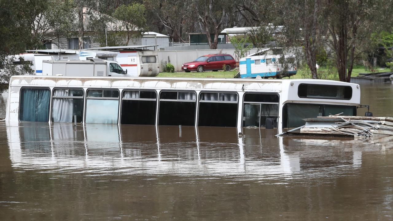 A bus floats in the Goulburn River. Picture: David Crosling