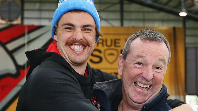 Neale Daniher (right) gets a hug from nephew Joe. Picture: Getty Images