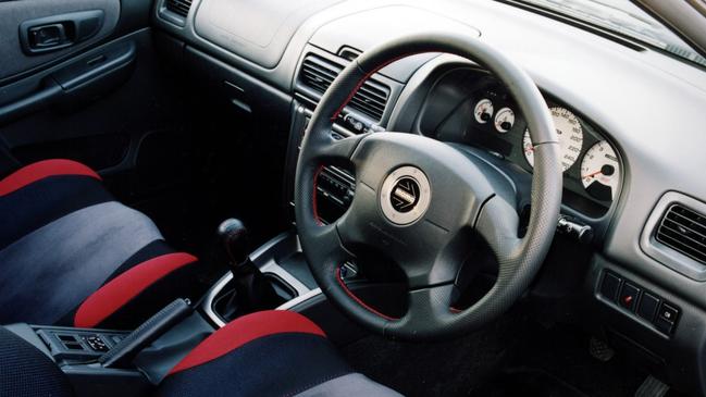 Sports seats and a Momo steering wheel feature inside the cabin.