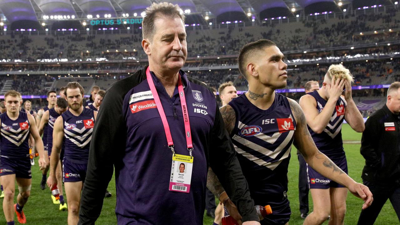 Ross Lyon, coach of the Fremantle Dockers leaves the field with his players after losing the Round 16 AFL match between the Fremantle Dockers and the West Coast Eagles at Optus Stadium in Perth, Saturday, July 6, 2019. (AAP Image/Richard Wainwright) NO ARCHIVING, EDITORIAL USE ONLY