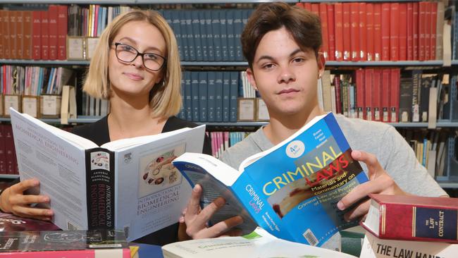 Biomedicine student Amy McEwen and Law student Matthew Major get a headstart in the Griffith University library. Picture Glenn Hampson