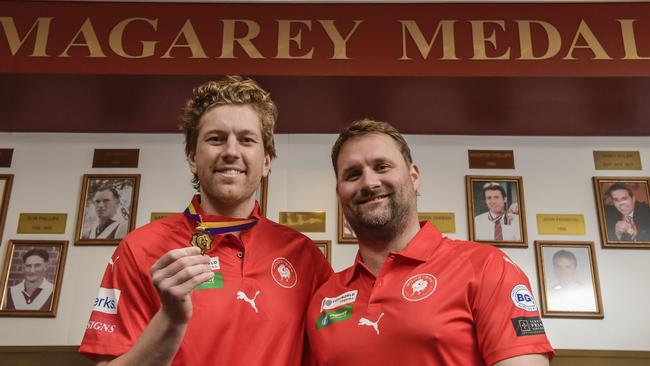 Aaron Young with Roosters coach Jacob Surjan after winning the Magarey Medal in 2022. Picture: Roy VanDerVegt