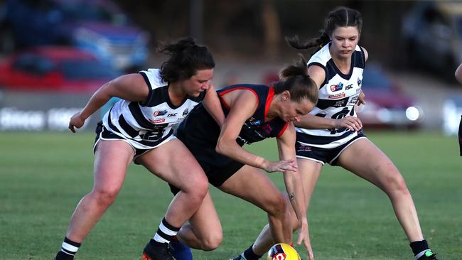 South Adelaide’s Nat Gibbs, Norwood’s Jo Hill and South’s Elke Jarvis battle for the ball during their SANFLW clash. Picture: Deb Curtis