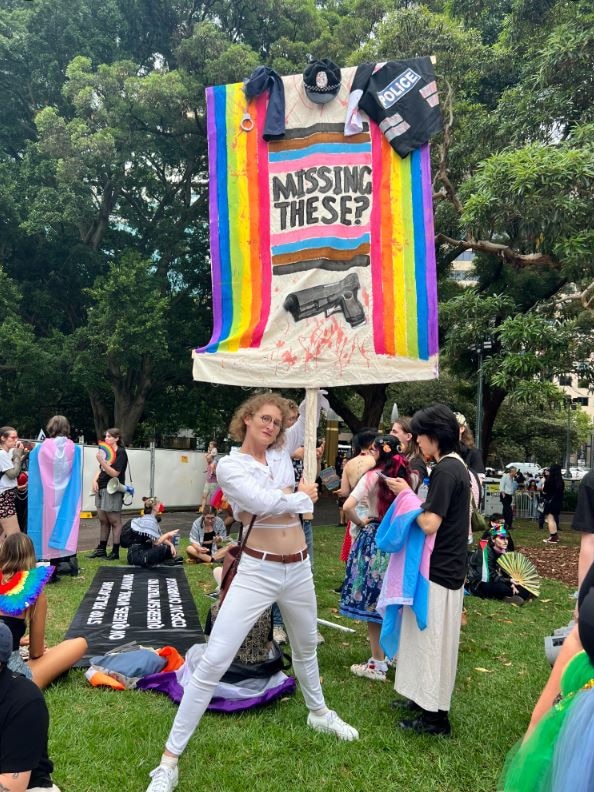 One protester brandished a large anti-police sign at the Hyde Park marshalling area. Picture: David Shoebridge/ Twitter