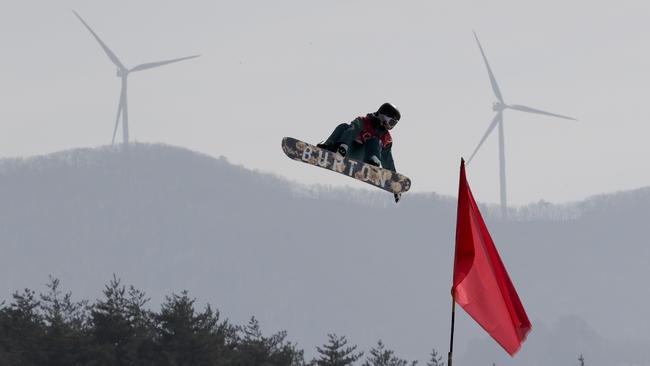 Jess Rich jumps during qualification for the women's big air snowboard competition. Picture: AP