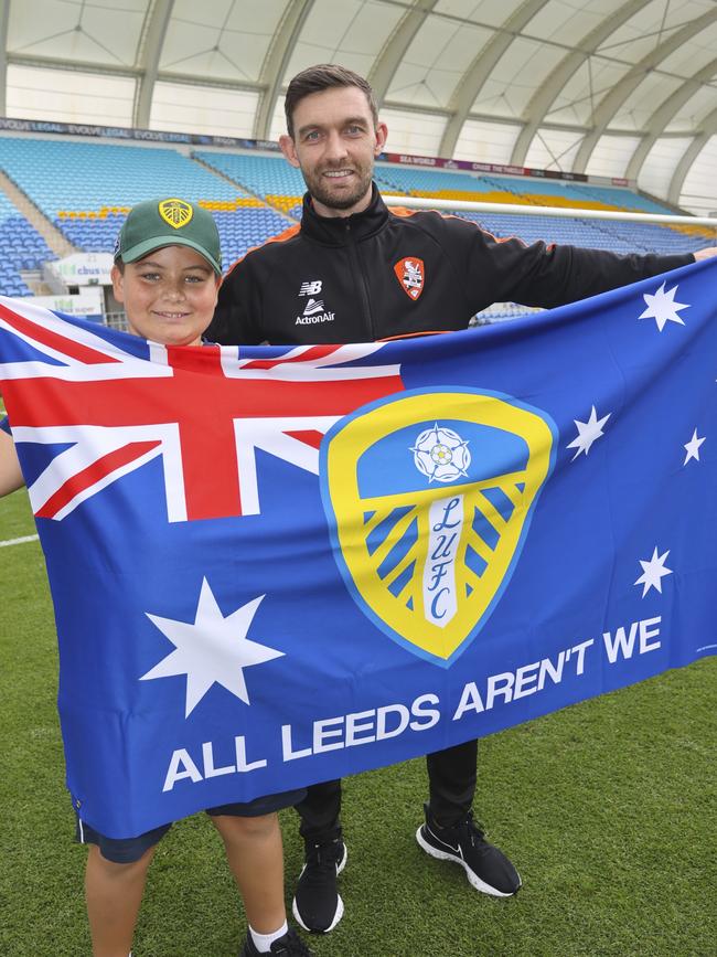 A young Leeds United supporter with Brisbane Roar star Jay O'Shea at Cbus Super Stadium.