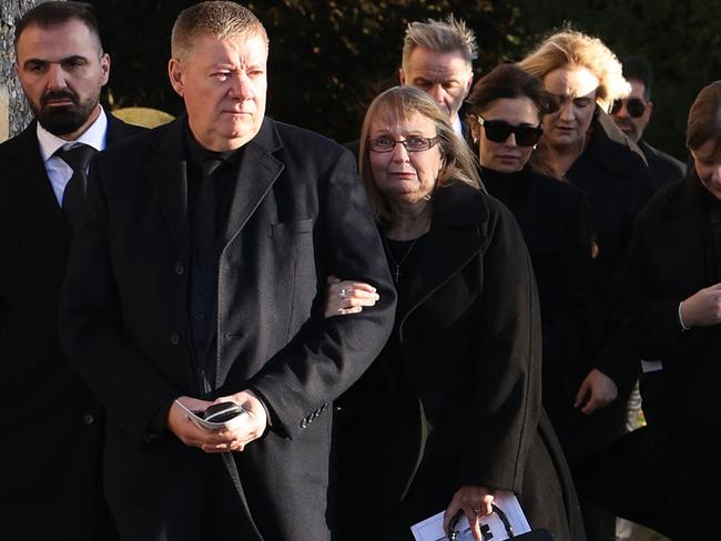 The singer’s parents, Geoff and Karen, and ex-partner Cheryl Tweedy lead mourners out of the service. Picture: Dan Kitwood/Getty Images