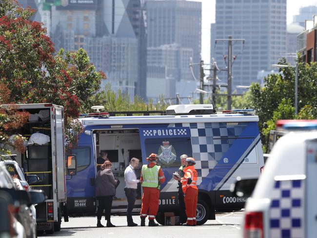 Police at the scene where a body was found in a Port Melbourne laneway. Picture: David Crosling