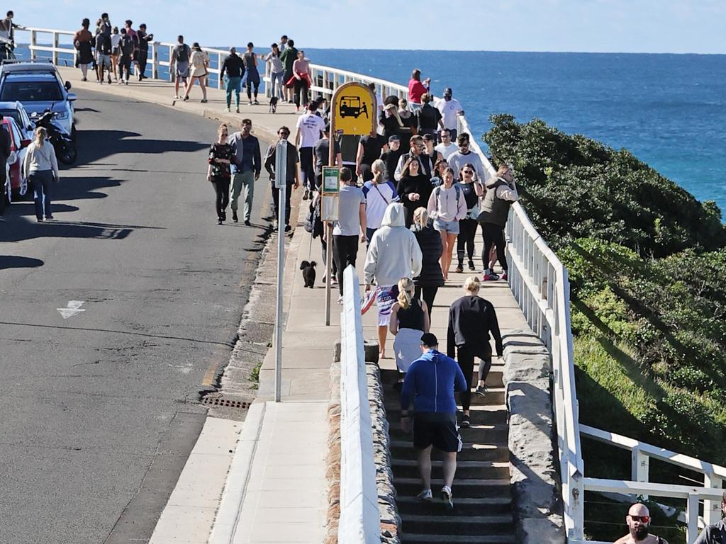 Crowds walking the coastal walk at Bronte Beach in Sydney today. Picture: Richard Dobson