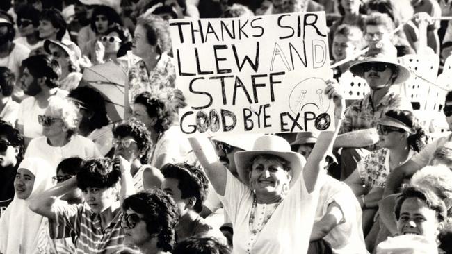 A woman in crowd holding sign " Thanks Sir Llew and Staff Expo Goodbye!!" - Oct. 1988