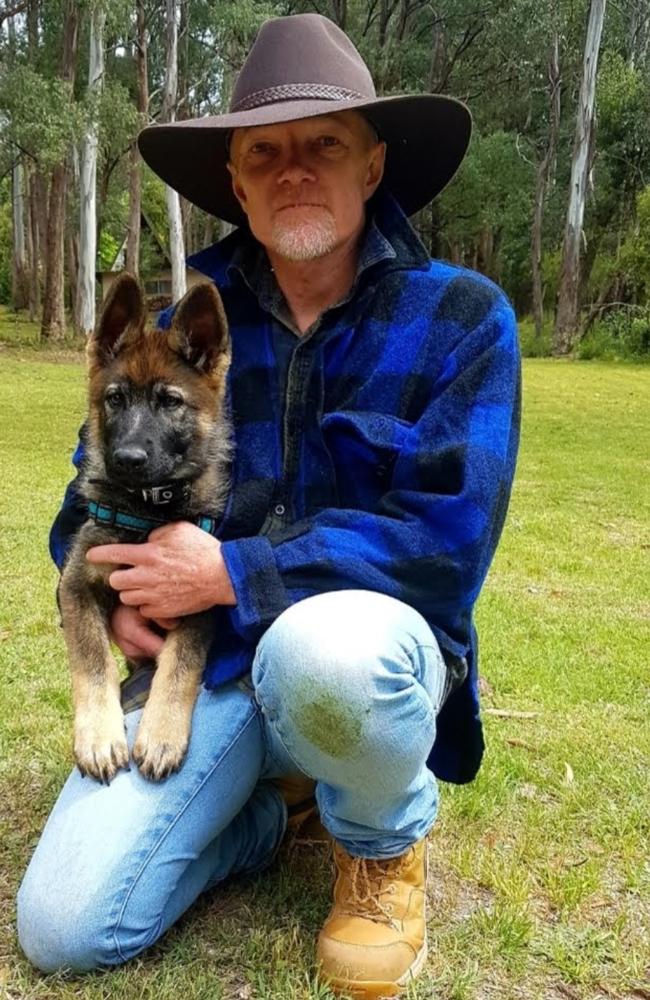 Former Dreamworld first aid manager Shane Green (pictured with dog Bos) is battling insurance giant CommInsure for a total and permanent disability payment in the wake of the Thunder River Rapids tragedy.