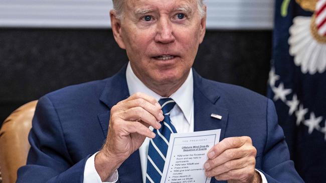 US President Joe Biden speaks from his notes at a meeting at the White House in Washington, DC, on June 23, 2022. (Photo by Jim WATSON / AFP)