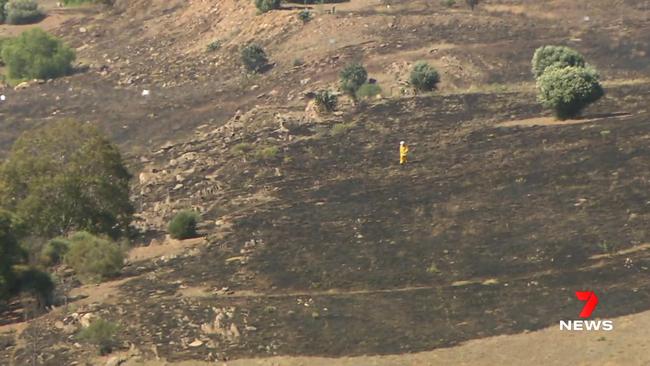 Water bombers have been called in to help firefighters bring a grass fire under control at Palmer. 7NEWS