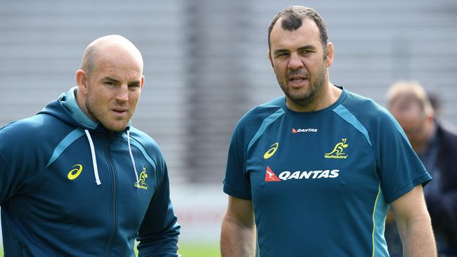 Wallabies coach Michael Cheika shares a moment with Stephen Moore at Ballymore.