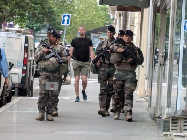 Soldiers armed with assault rifles are roaming the streets of Paris while you eat breakfast. Picture: news.com.au