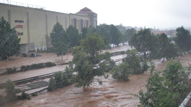 Images taken by resident Penny Cowell as flash floods hit the city of Toowoomba, west of Brisbane causing widespread damage and deaths, as torrential rain continues to fall in flood-ravaged Queensland.