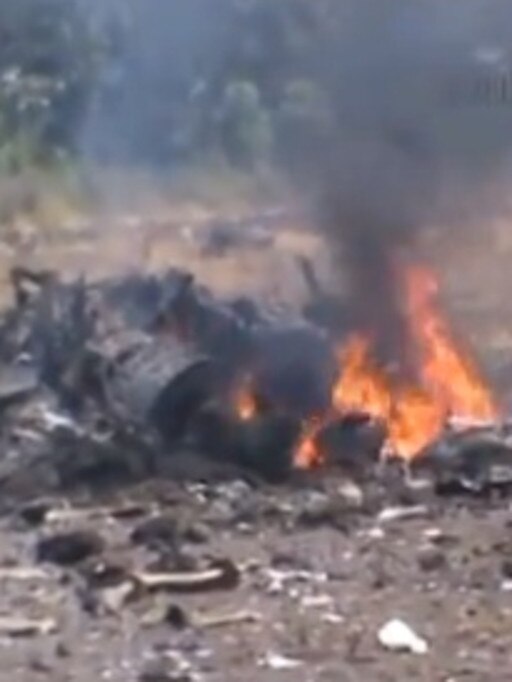 The wreckage goes up in flames.