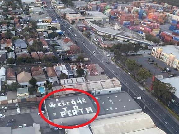 The sign on the roof of the business flying into Sydney Airport.