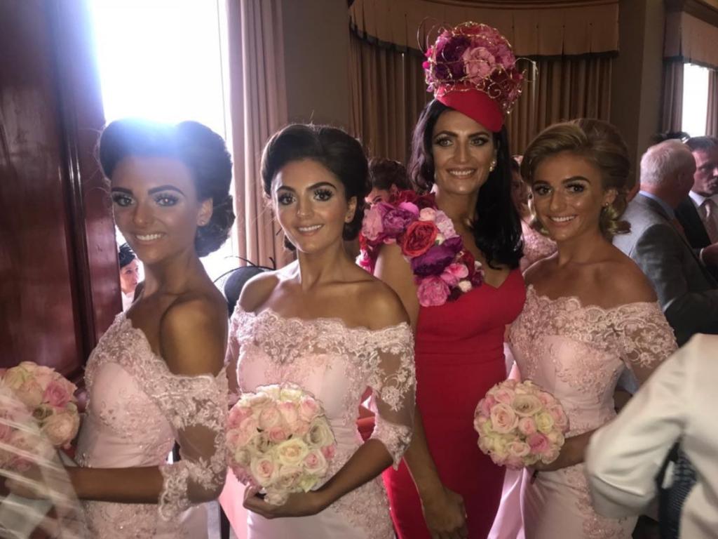 Louise with three of her daughters at a family wedding. Picture: Instagram/louiseyoung1975