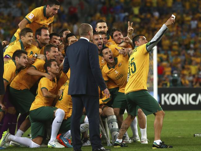 SYDNEY, AUSTRALIA - JANUARY 31: Tim Cahill of Australia takes a selfie of the team after the 2015 Asian Cup final match between Korea Republic and the Australian Socceroos at ANZ Stadium on January 31, 2015 in Sydney, Australia. (Photo by Ryan Pierse/Getty Images)