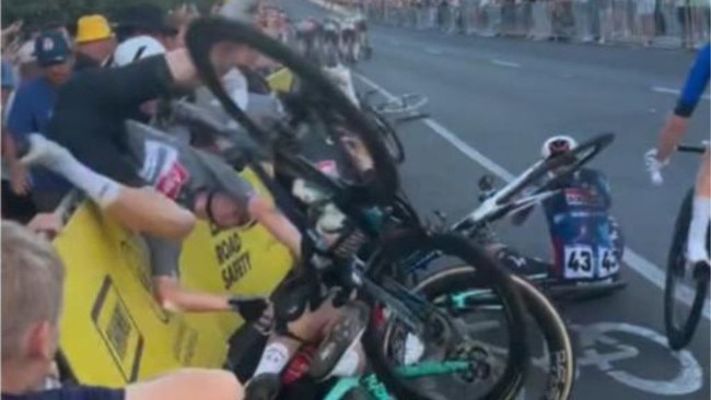 A devastating crash has marred Saturday’s Tour Down Under, leaving a fan hospitalized with serious injuries.