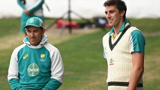 Pat Cummins and Langer chat during a nets session at Blundstone Arena in Hobart. Picture: Getty Images