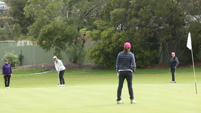 Amira Sharman putting on the 10th hole at Box Hill Golf Course. Picture: Hamish Blair