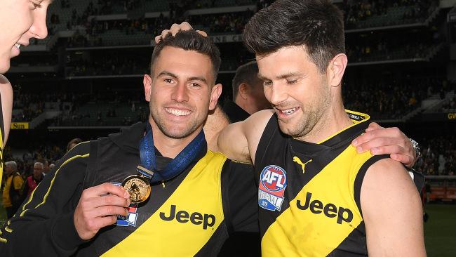 Richmond captain Trent Cotchin celebrates last year's premiership with Jack Graham.