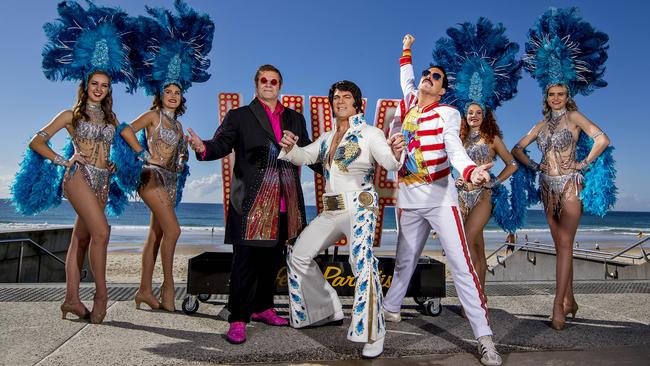 Greg Andrew as Elton John alongside Brendon Chase as Elvis and John Blunt as Freddie Mercury, with Vegas-style showgirls ahead of the Viva festival on the Gold Coast in July. Picture: Jerad Williams