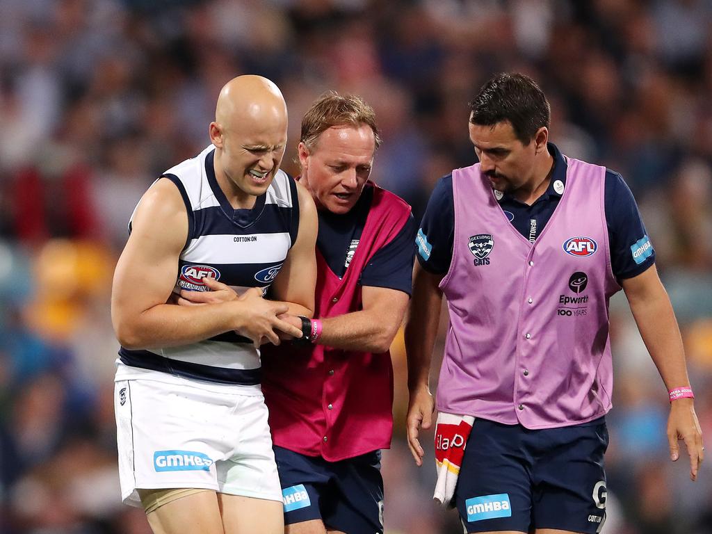 Gary Ablett comes off with an elbow injury.